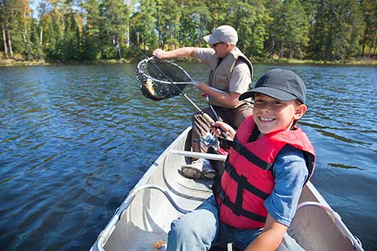 Young-boy-fisherman-smiles-at-catch-of-nice-walleye-000038558706_Full_Re.jpg